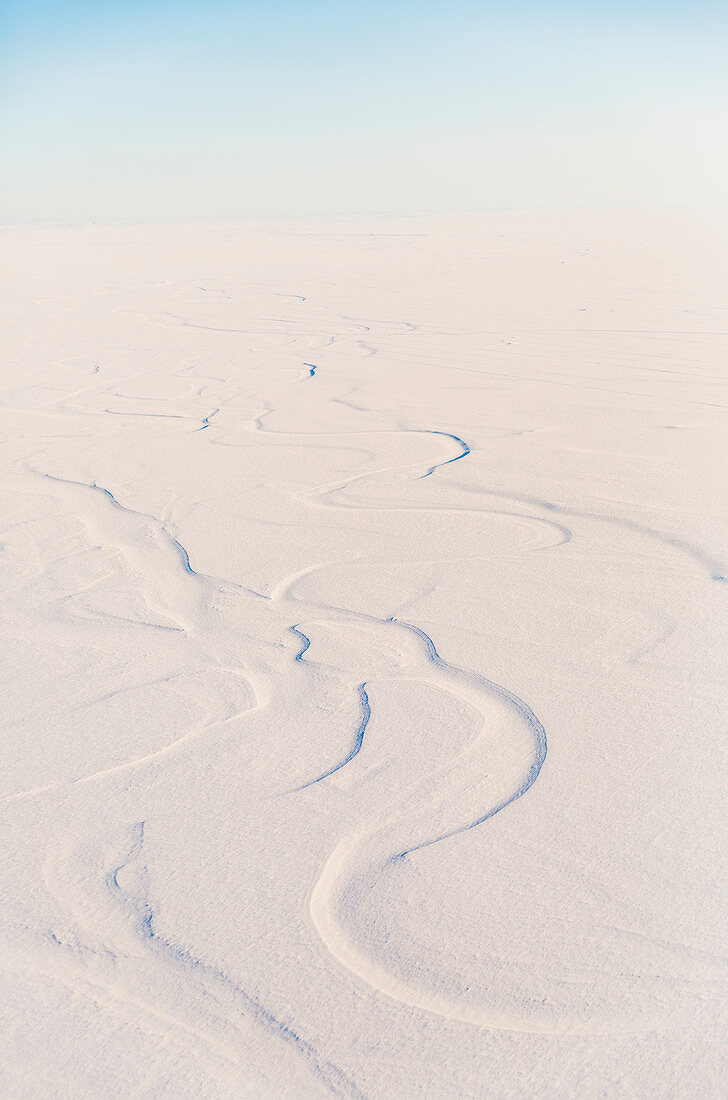 Aerial view of snow drifted into patterns by the wind, North Slope, Arctic Alaska, USA, Winter