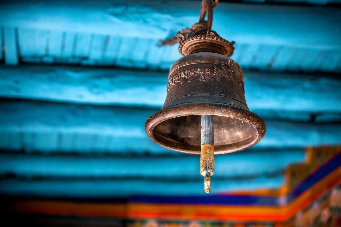 'A old brass bell hangs in a Tibetan monastery; Ladakh, India'