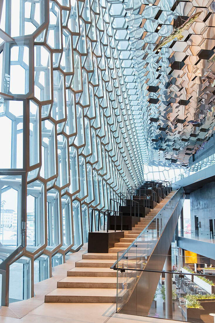 'Stairs in the interior of the Harpa Public Concert Hall, designed by the Danish firm Henning Larsen Architects and the Icelandic firm Batteriao Architects, the glass facade designed by Icelandic glass artist Olafur Eliasson; Reykjavik, Iceland'