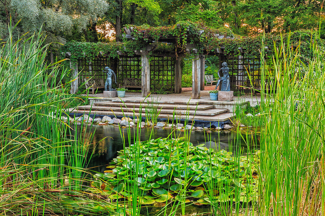 'Pergola and lily pond in Leo Mol Sculpture Garden of Assiniboine Park; Winnipeg, Manitoba, Canada'