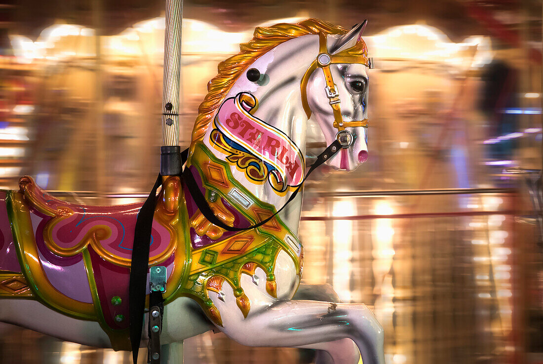 'Close up of a painted horse on a carousel with blurred lights in the background; Sunderland, Tyne and Wear, England'