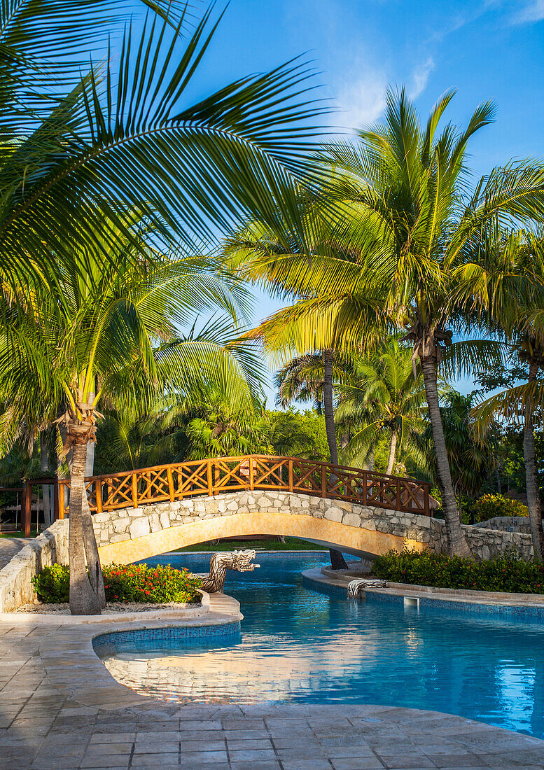 'Swimming pool and footbridge at a resort on the Caribbean; Playa del Carmen, Quintana Roo, Mexico'