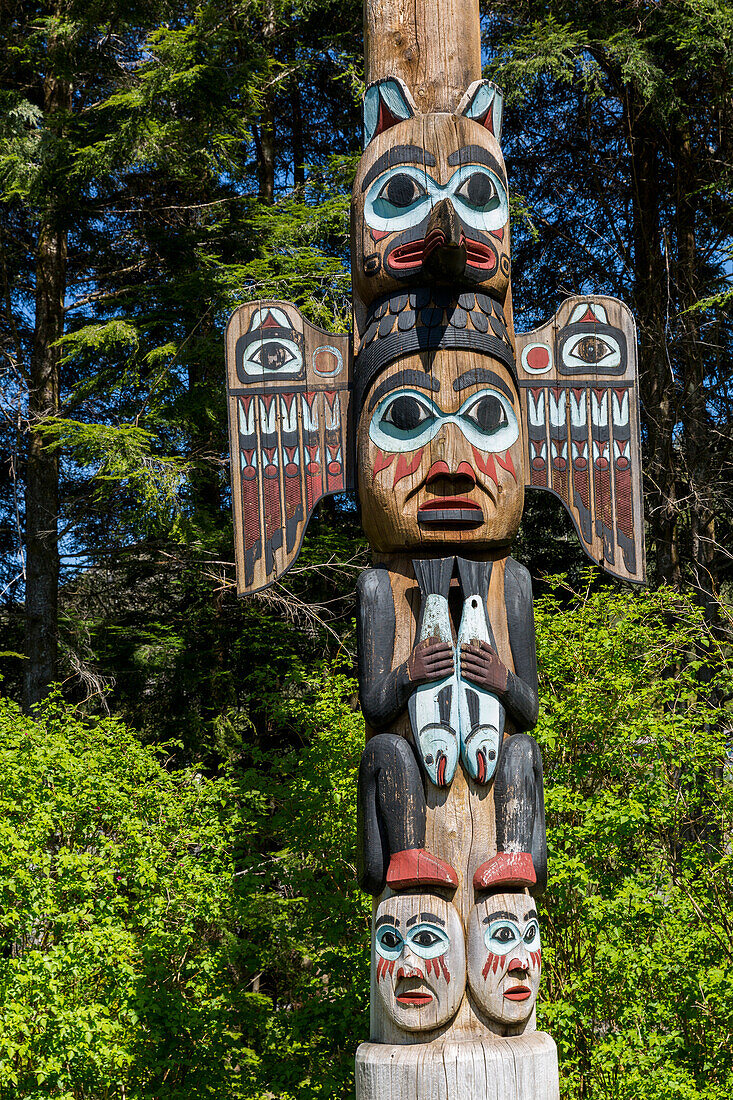 Native Alaskan totem pole on a sunny day, Totem Bight State Historical Park, Ketchikan, Southeast Alaska, USA