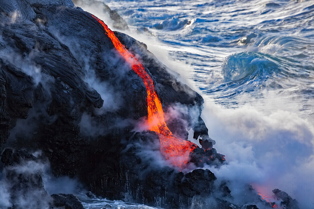 'The Pahoehoe lava flowing from Kilauea has reached the Pacific ocean near Kalapana; Island of Hawaii, Hawaii, United States of America'