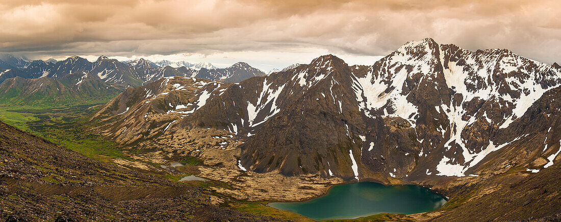 A panoramic view of Skip Lake and valley from Ship Pass in the Chugach State Park near Anchorage, Southcentral Alaska, summer