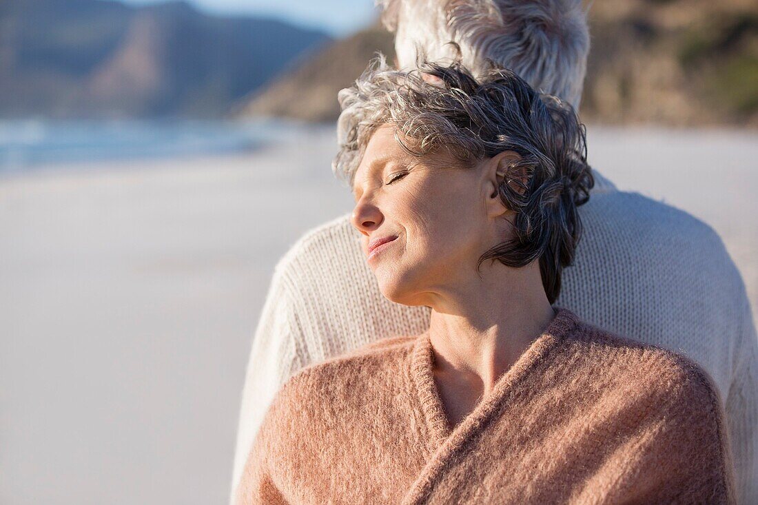 Close-up of an old couple on the beach