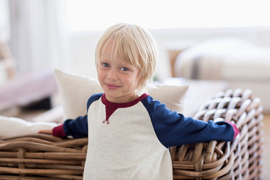 Portrait of a happy little boy in living room