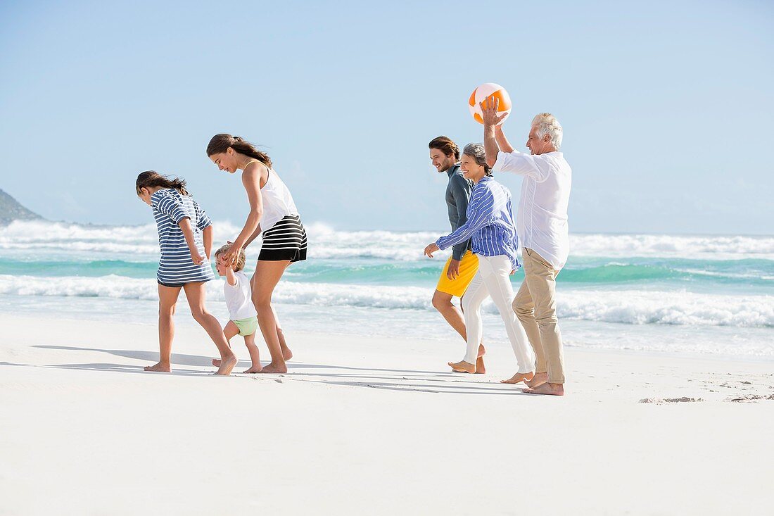 Multi-generation family enjoying on the beach