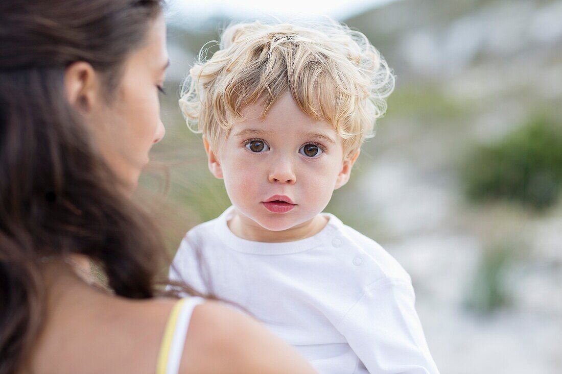 Close-up of a baby boy with his mother