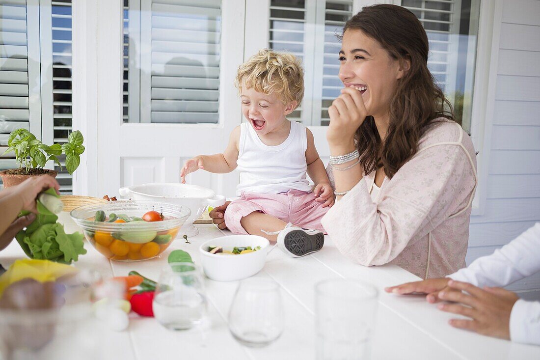 Happy family preparing food at home