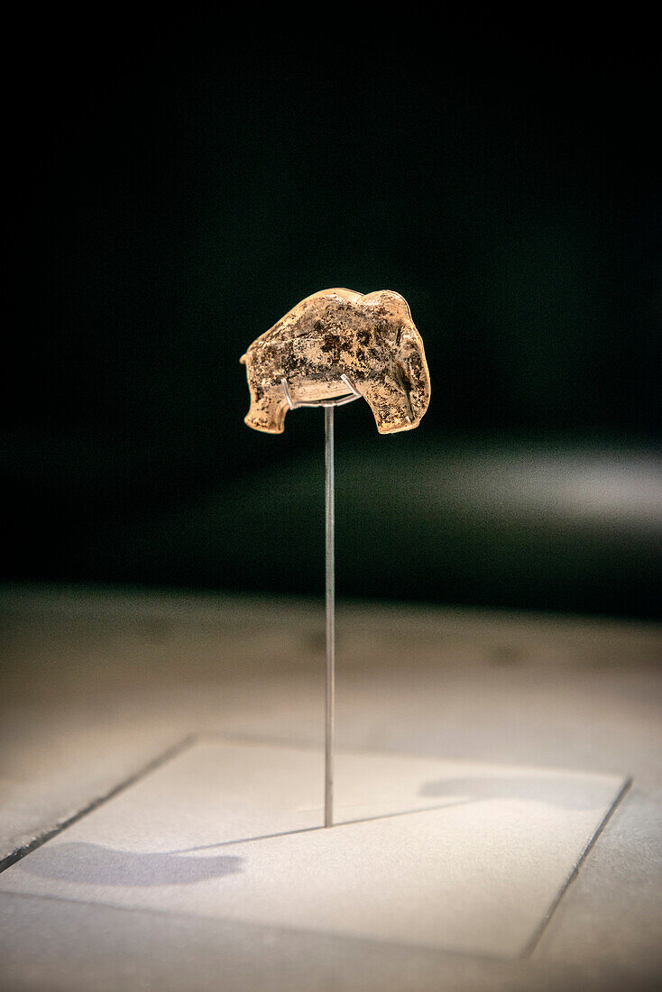 exhibit at archeological site shows mammoth carved out of mammoth ivory, the Vogelherd Cave is an important place of discovery for ice age art, Niederstotzingen, Heidenheim district, Swabian Alb, Baden-Wuerttemberg, Germany