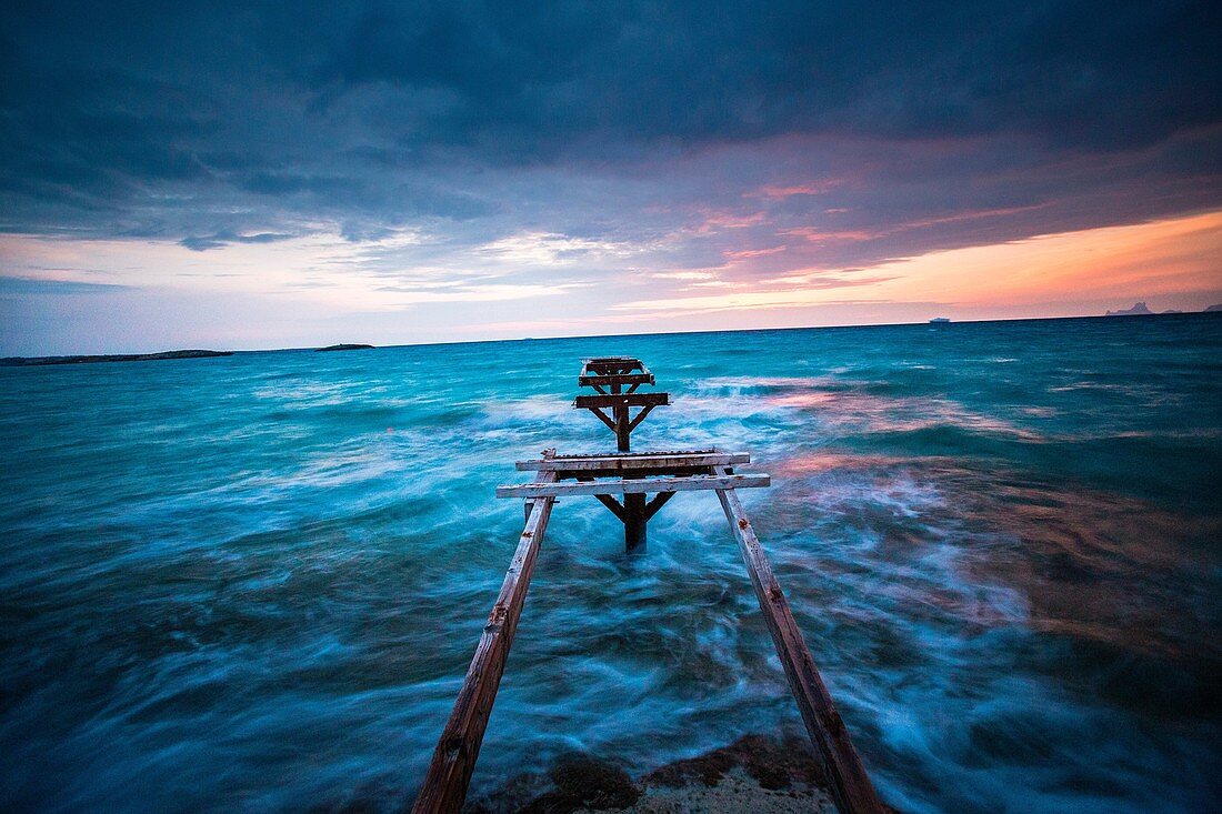 The pier of Es Ministre in Illetas, during the sunset. Formentera (Balearic Islands).