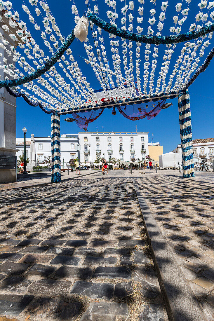 Colors and decoration in the pedestrian centre of Tavira on a sunny summer day, Faro, Algarve, Portugal, Europe