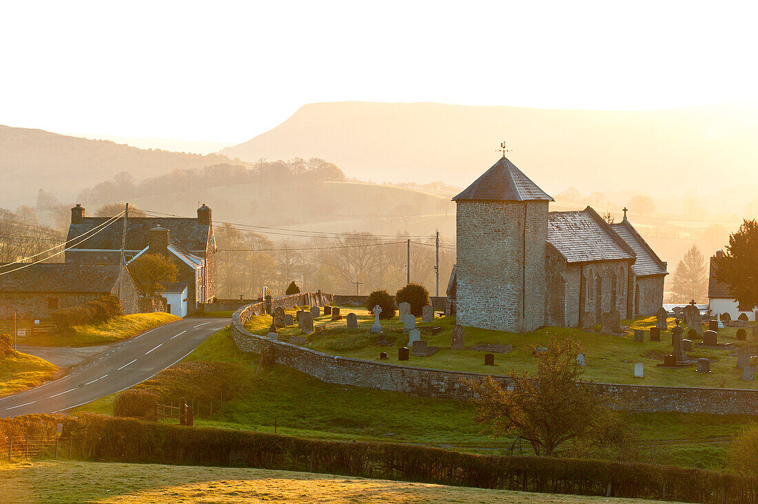 A view at sunrise of St. David's Church in the tiny hamlet of Llanddewi'r Cwm, Powys, Wales, United Kingdom, Europe