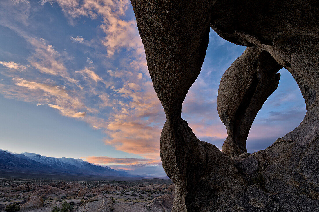 Sunset through Cyclops' Skull Arch, Alabama Hills, Inyo National Forest, California, United States of America, North America