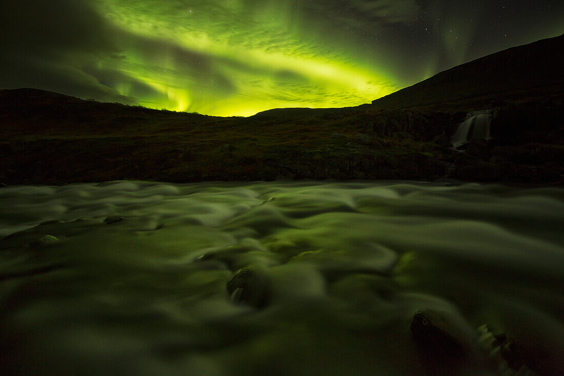 'Northern lights over Dynjandi in the Westfjord region of Iceland, Dynjandi is a series of seven waterfalls; Westfjords, Iceland'