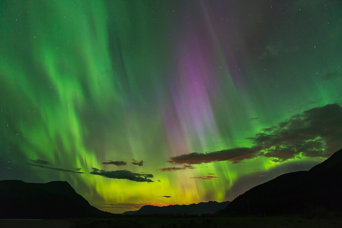 The aurora borealis fills the sky over the Chugach and Kenai Mountains, Southcentral Alaska