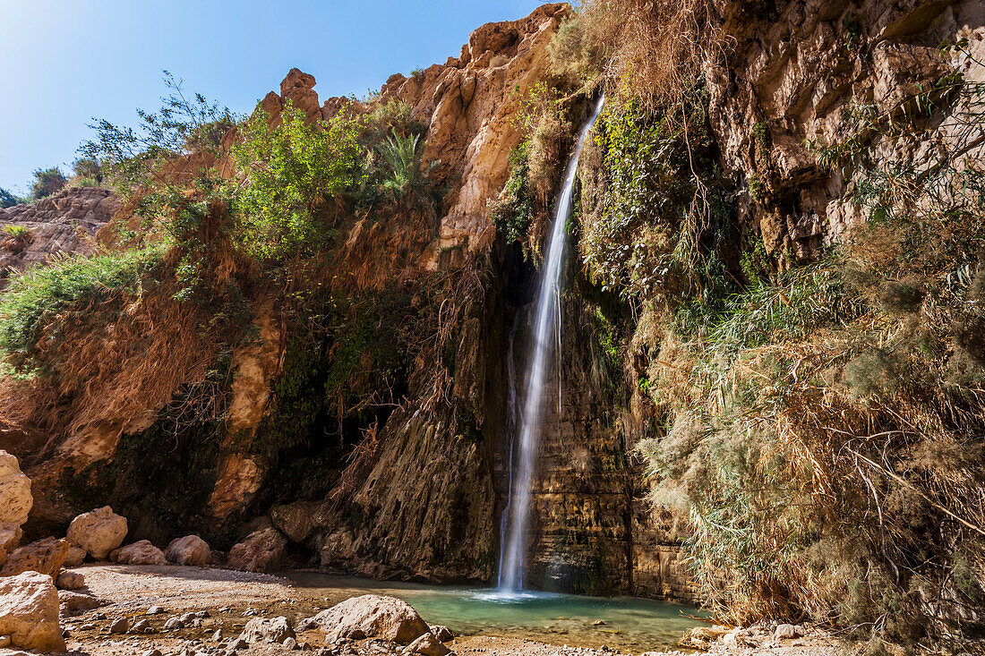 'Water flowing out of a rock cliff; Israel'