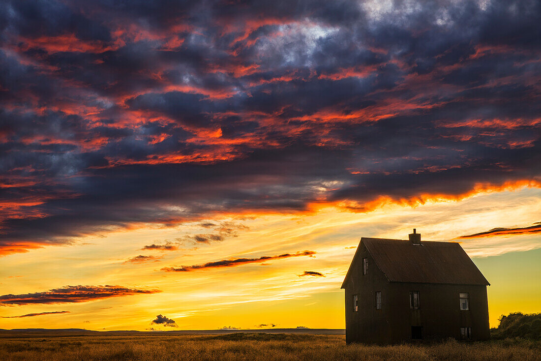 'Abandoned house in rural Iceland with a brilliant sunset; Iceland'