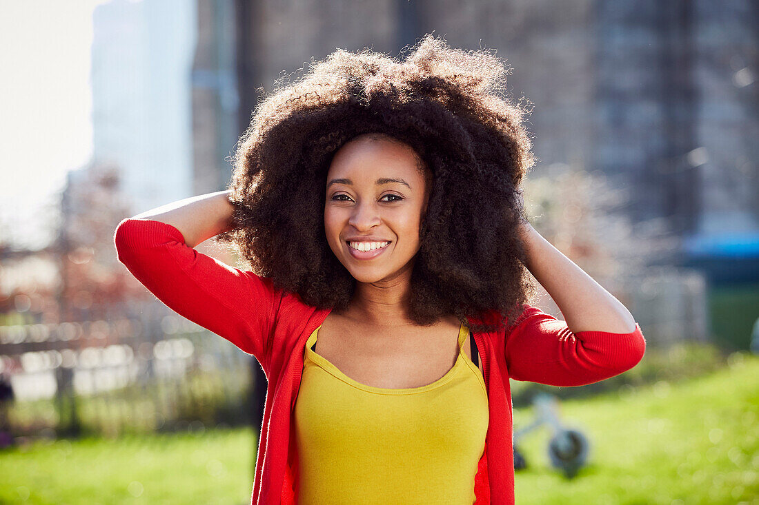 Smiling Black woman posing at waterfront