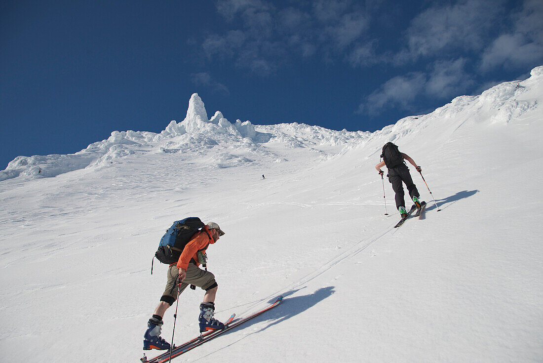 Skiers ascend the Northeast flanks of  Mt Augustine, a 4,025-foot high active volcano on Augustine Island in Cook Inlet, Alaska. The lava dome volcano is part of the Ring of Fire and last erupted in 2006.