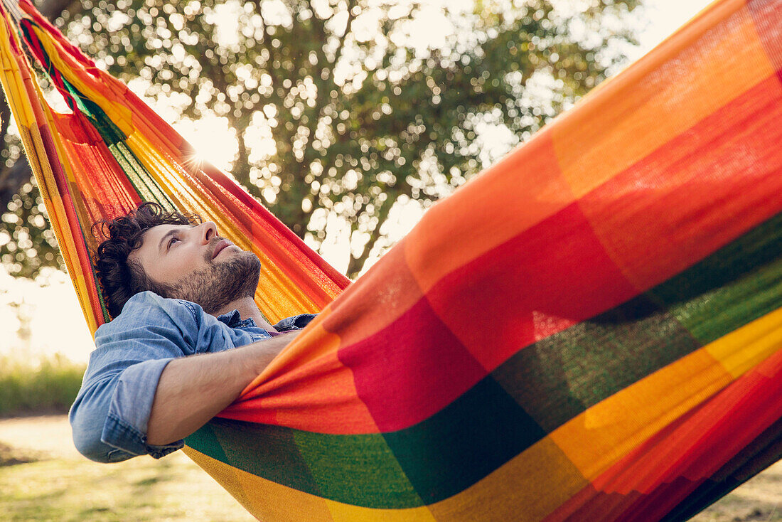 Man relaxing in hammock