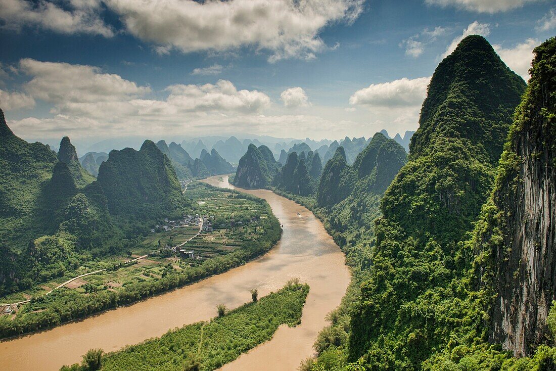 Boat traveling up the scenic Li River, Xingping, Guangxi Autonomous Region, China.