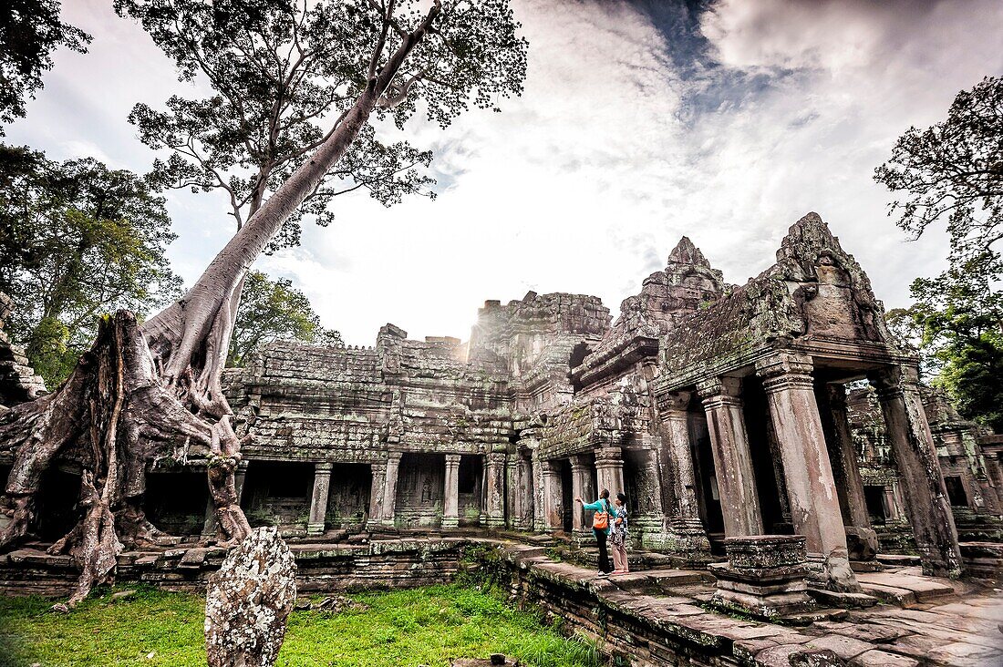 Locals in Preah Khan Temple in Angkor, which is located near Siem Reap (province of Siem Reap, Cambodia).