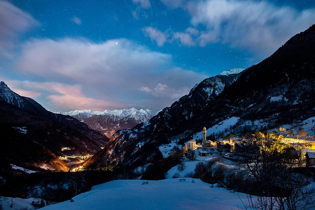The first lights of sunrise on the village of Soglio. Bregaglia Valley Canton of Graub??nden Switzerland Europe