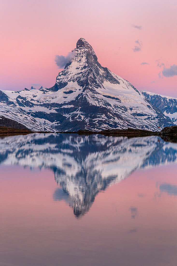 Switzerland, Vallese, the Matterhorn at sunrise reflected at Stellisee, Zermatt valley