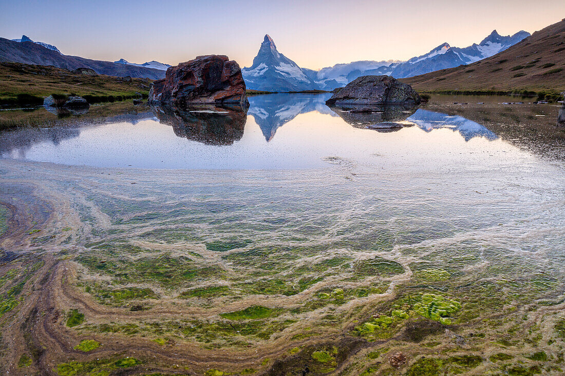 The Matterhorn reflected in Lake Stellisee at dawn Zermatt Pennine Alps Canton of Valais Switzerland Europe