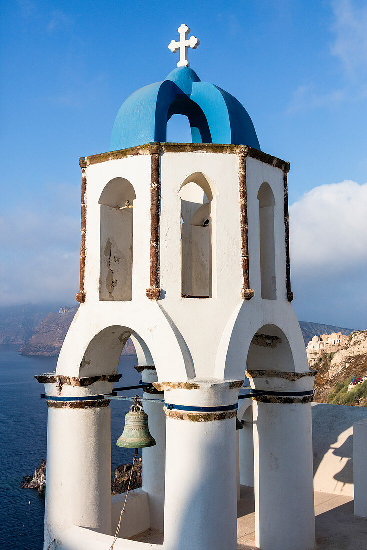 The blue dome of the church dominates the Aegean Sea Santorini Cyclades Greece Europe