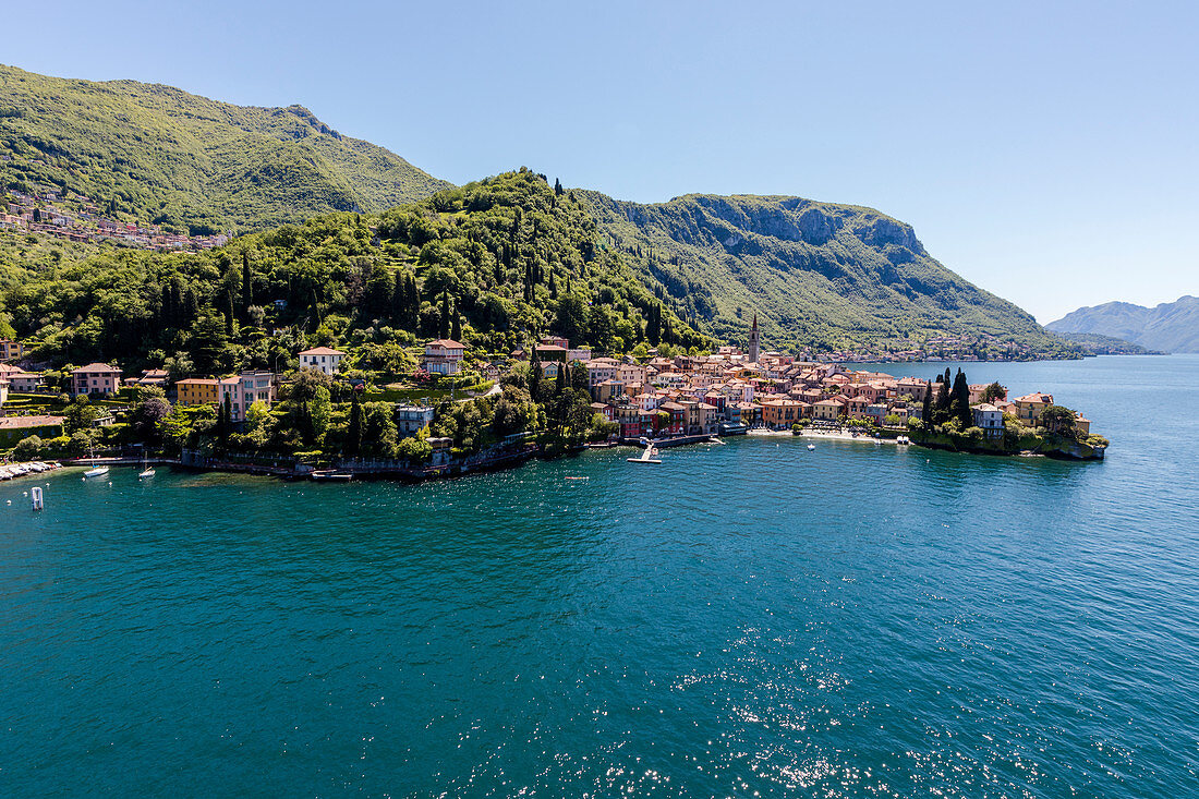 Aerial view of Varenna frames by the blue water of Lake Como on a sunny spring day Lecco Province Lombardy Italy Europe