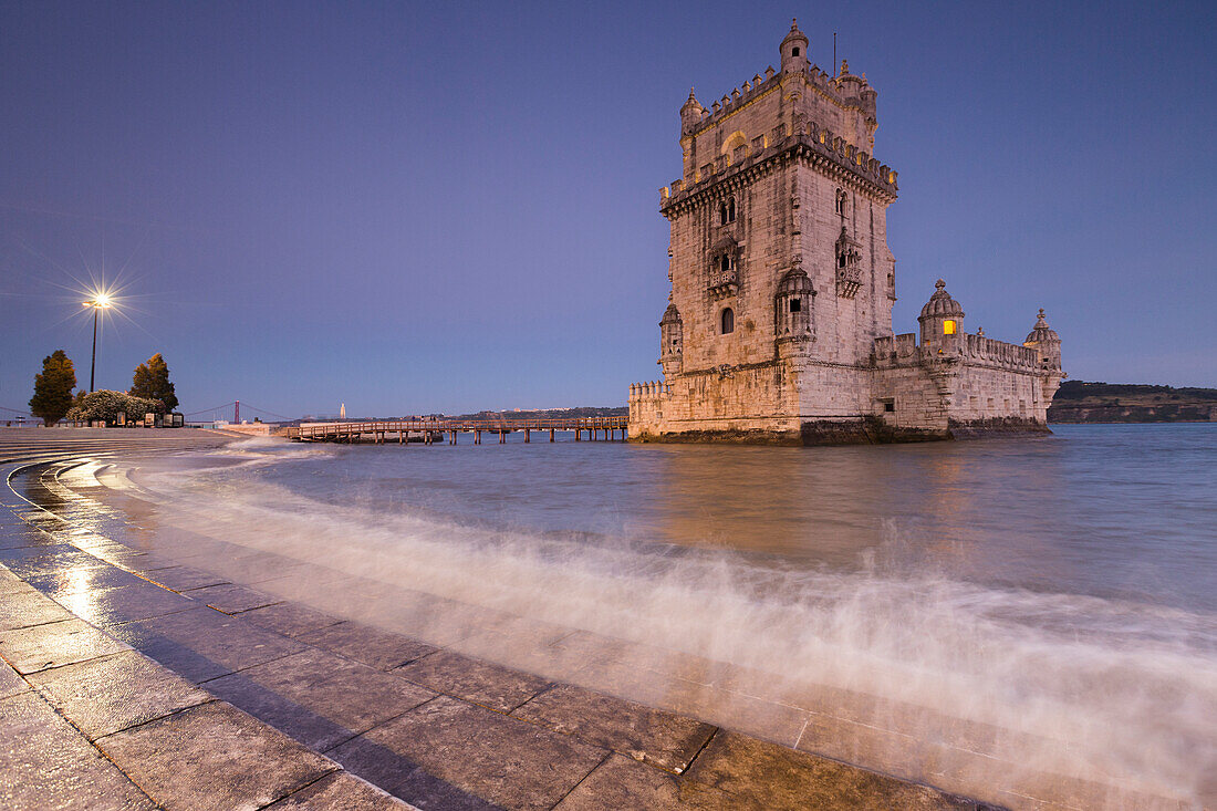 Dusk and lights on the Tower of Bel?®m reflected in Tagus River Padr?úo dos Descobrimentos Lisbon Portugal Europe