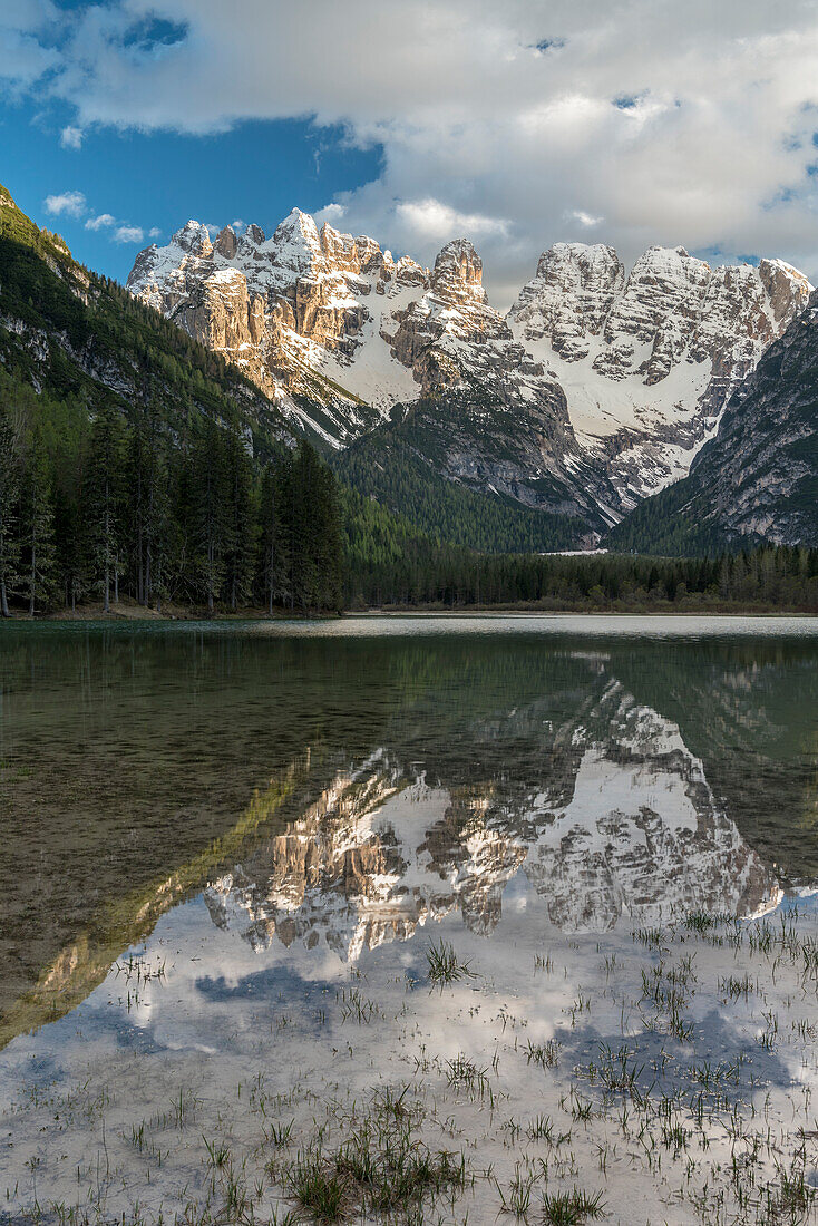 Carbonin, Dolomites, South Tyrol, Italy. Lake Landro with the peaks of the Cistallo group at sunset