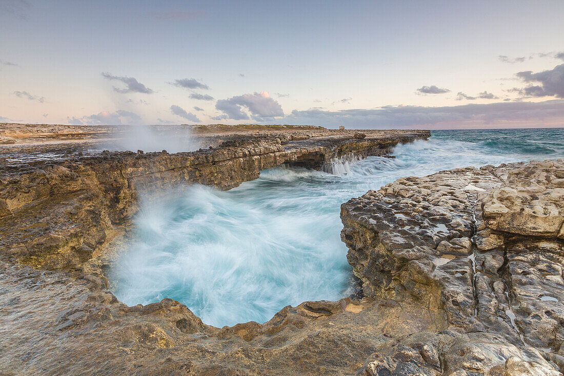 Waves of the rough sea crashing on the cliffs of Devil's Bridge Caribbean Antigua and Barbuda Leeward Islands West Indies