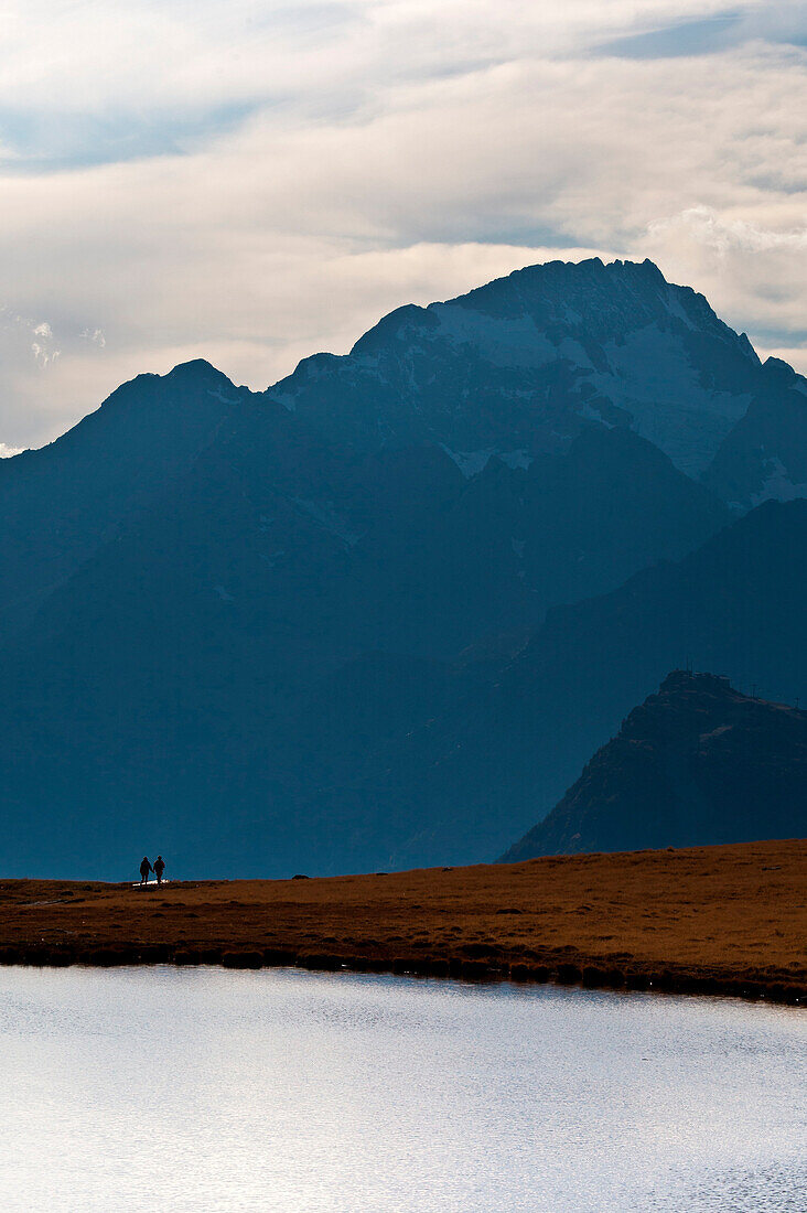 The unmistakable silhouette of Mount Disgrazia stands majestic on Lake Campagneda. Valmalenco. Lombardy. Italy Europe