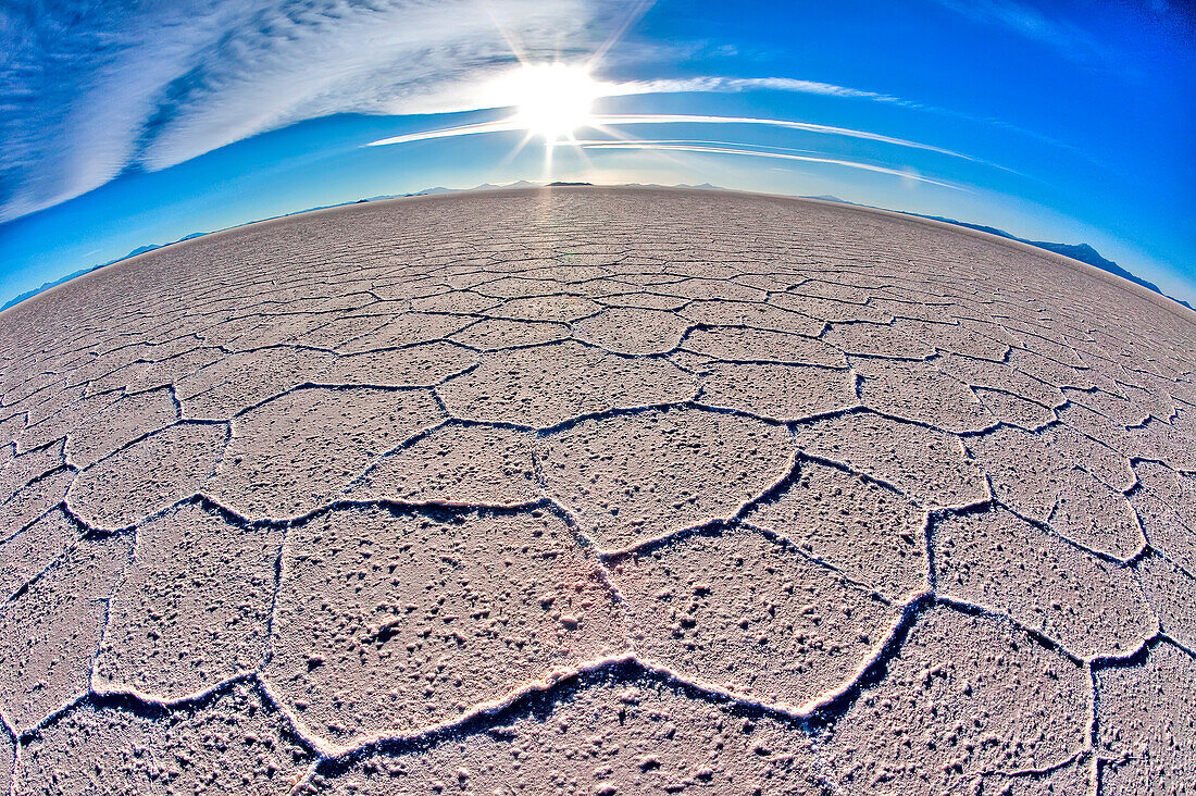 The curvature of the earth is accentuated by fish eye effect in the huge expanse of salt in the Salar de Uyuni. South Lipez. Bolivia. South America