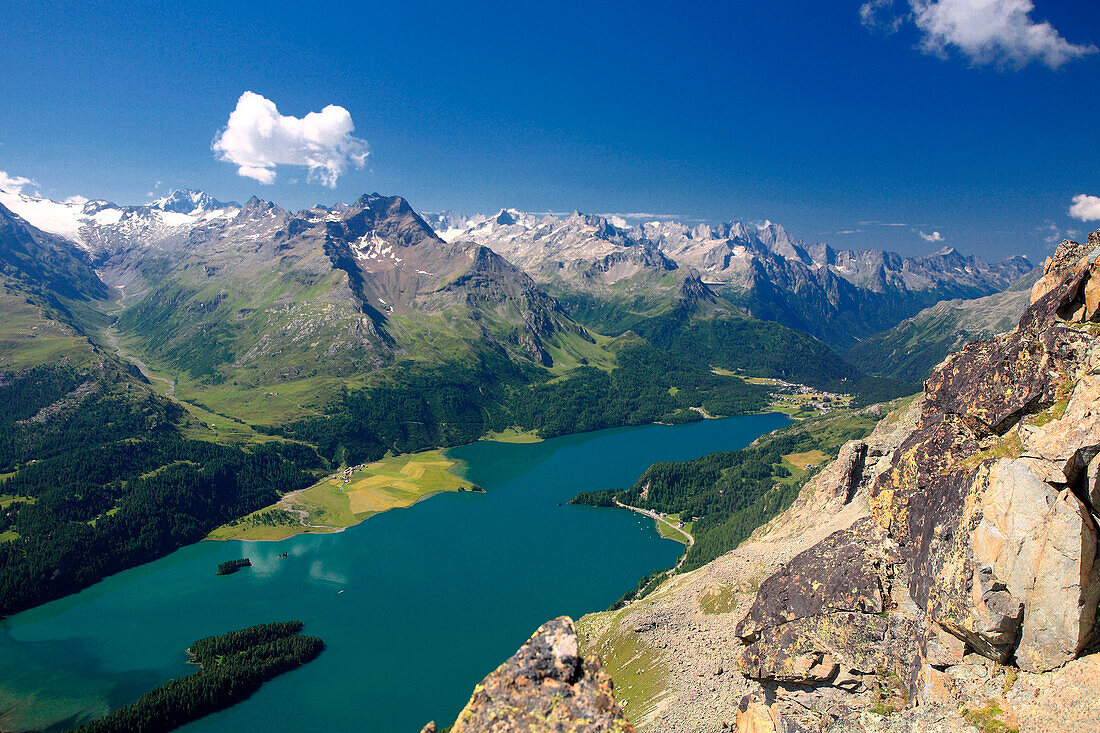 The lake of Sils seen by piz Lagrev, in the background piz de la Margna, on the left Val di fex and on the right Maloja Pass, Engadine, Switzerland Europe