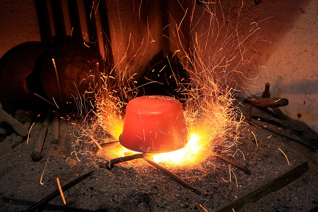 The production of a copper pot in a laboratory in Morbegno, Valtellina, Lombardy Italy Europe