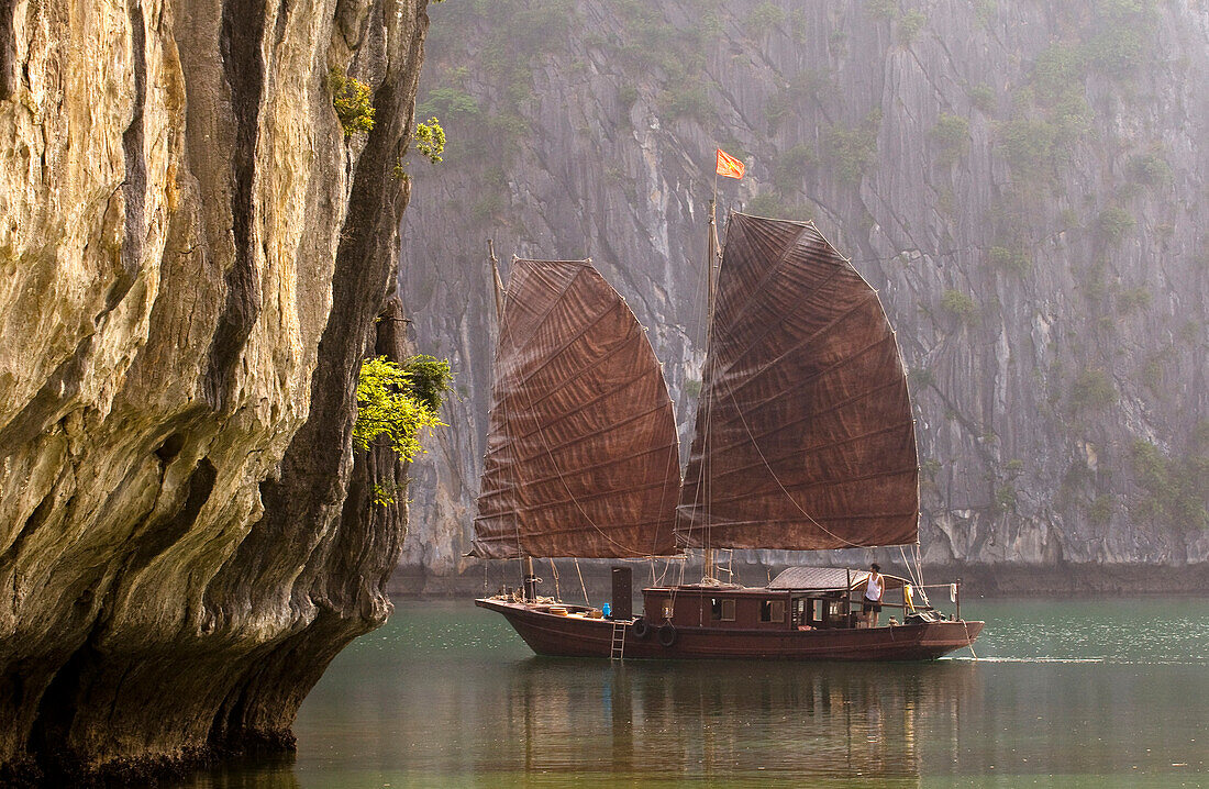 Vietnam, Quang Ninh Province, Along Bay, listed as World Heritage by UNESCO, traditional junk