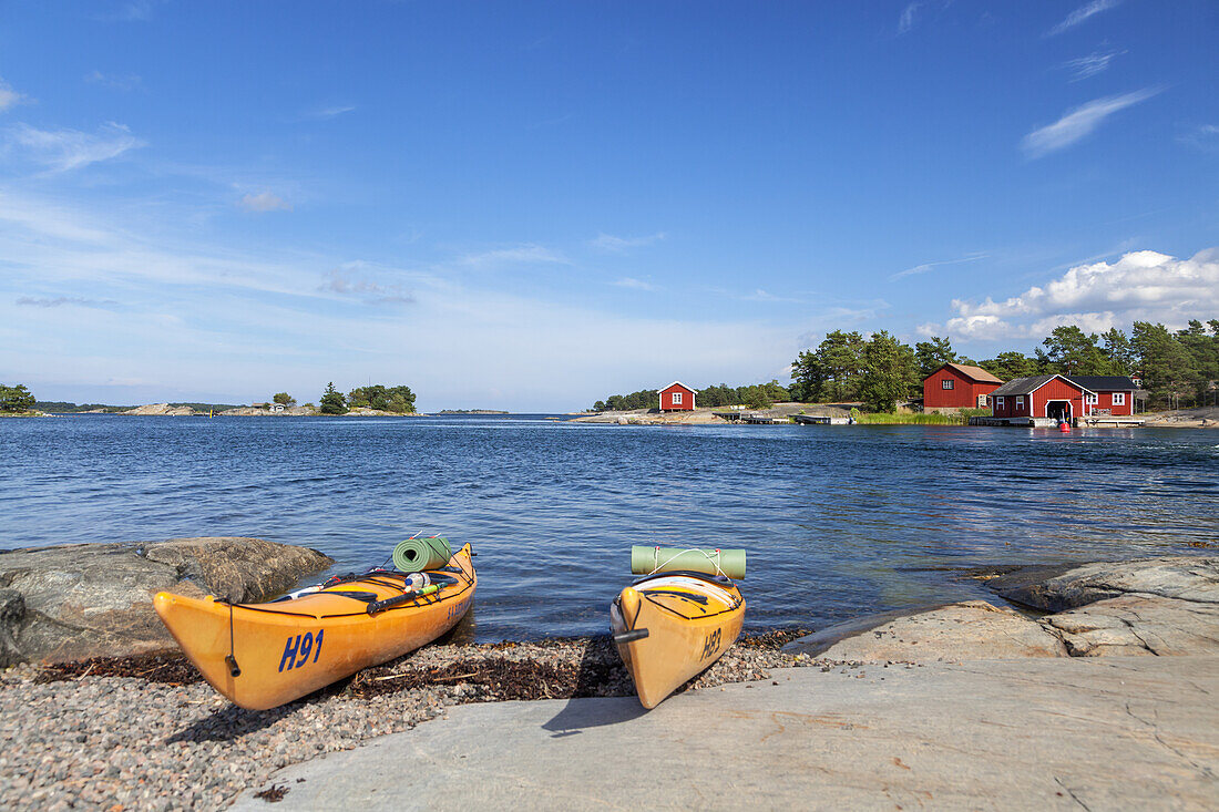 Kayaks on the beach in Langvik, island of Moeja in Stockholm archipelago, Uppland, Stockholms land, South Sweden, Sweden, Scandinavia, Northern Europe
