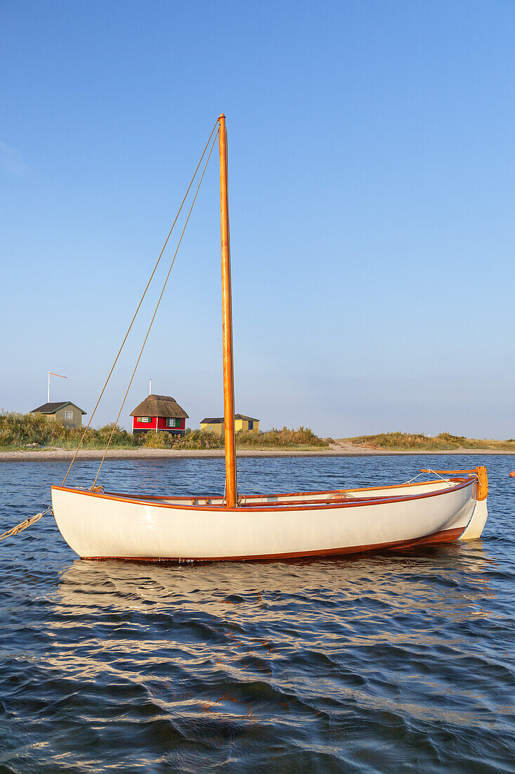 Sailboat on the Baltic Sea in front of cottages at the beach Erikshale, island Ærø, Marstal, South Funen Archipelago, Danish South Sea Islands, Southern Denmark, Denmark, Scandinavia, Northern Europe