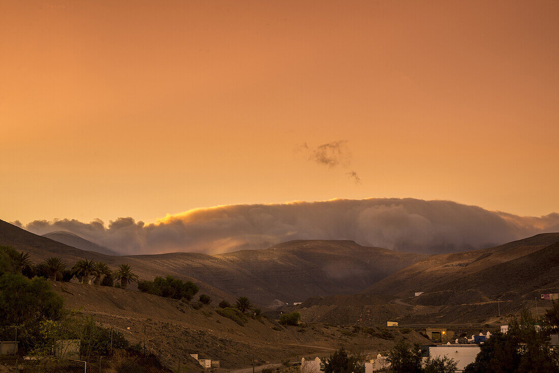 Passat clouds over the mountain Pico de la Zarza in the Evening. Morro Jable, Fuerteventura, Canary Islands, Spain