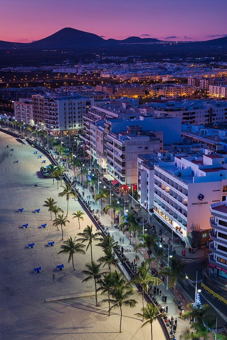 Spain, Canary Islands, Lanzarote, Arecife, elevated city view above Playa del Reducto beach, dusk.