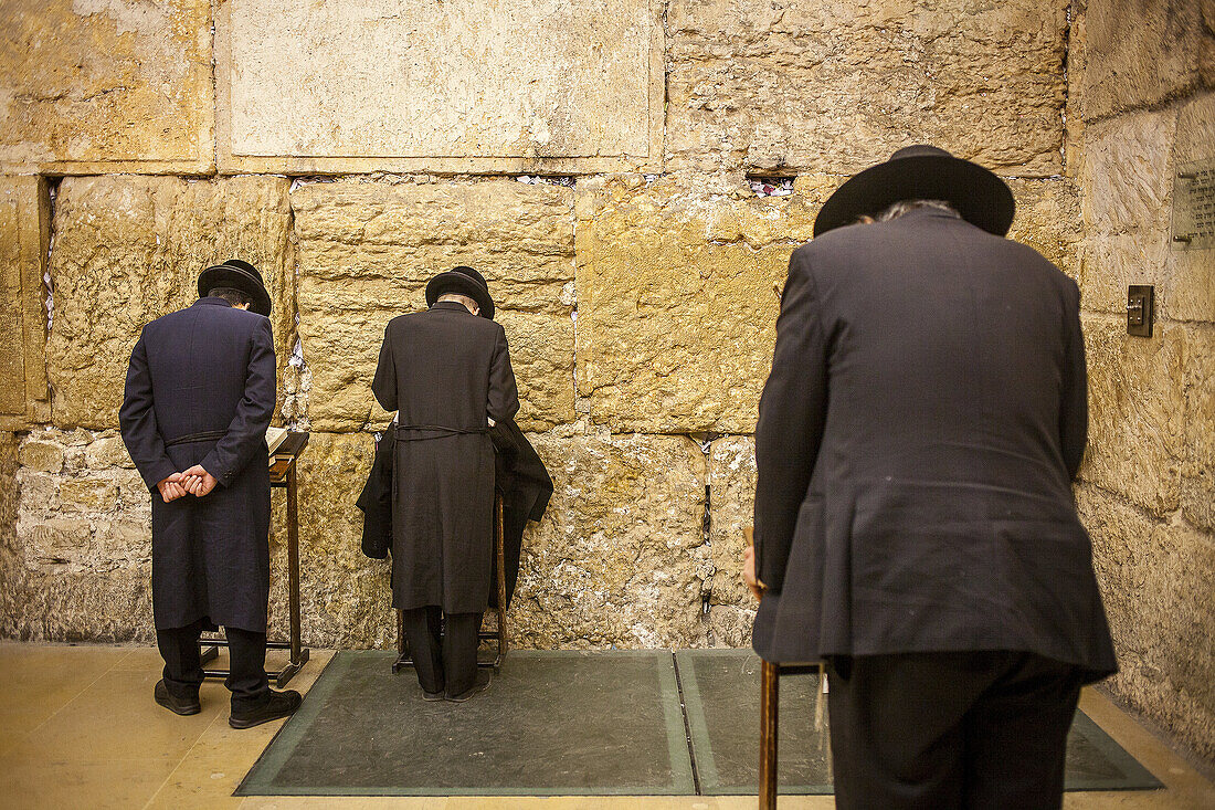 men's prayer area, praying at the Western Wall, Wailing Wall,in Wilson's arch, Jewish Quarter, Old City, Jerusalem, Israel.