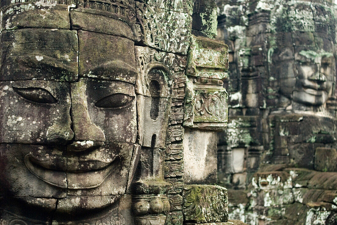 The faces of the Bayon temple. Angkor Thom. Angkor Thom was built as a square, the sides of which run exactly north to south and east to west. Standing in the exact center of the walled city, Bayon Temple represents the intersection of heaven and earth.