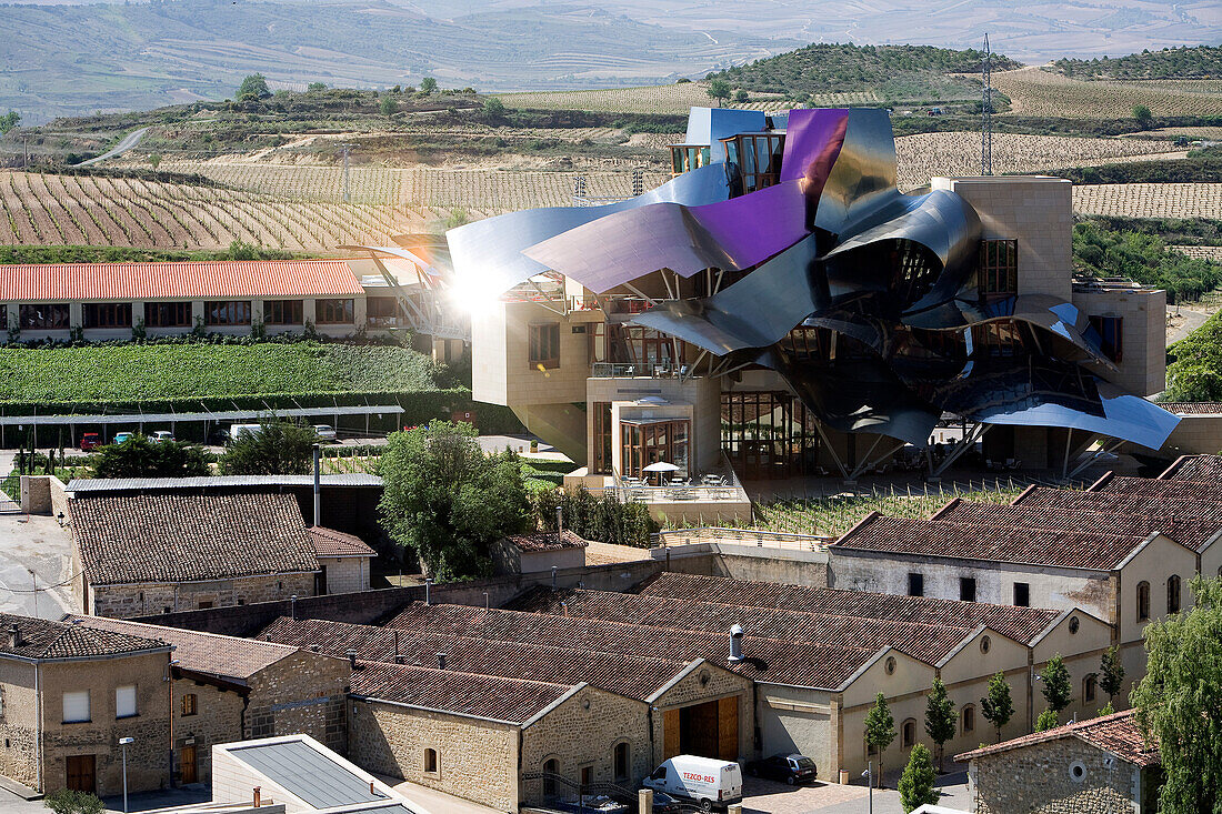 Spain, Spanish Basque Country, Alava Province, Rioja Alavesa, Elciego, Marques de Riscal Starwood luxury hotel by architect Frank Gehry, the hotel and vineyard