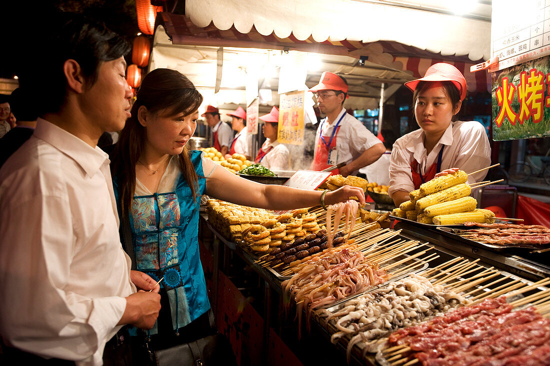 China, Beijing, night street market off Wanfujing street