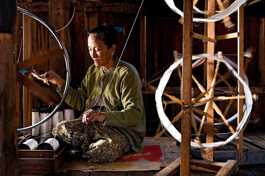 Myanmar (Burma), Shan State, Inle Lake, village of Inn Paw Khon, Setkyar Mya silk manufacturing workshop, Daw Aye Nain working on a loom